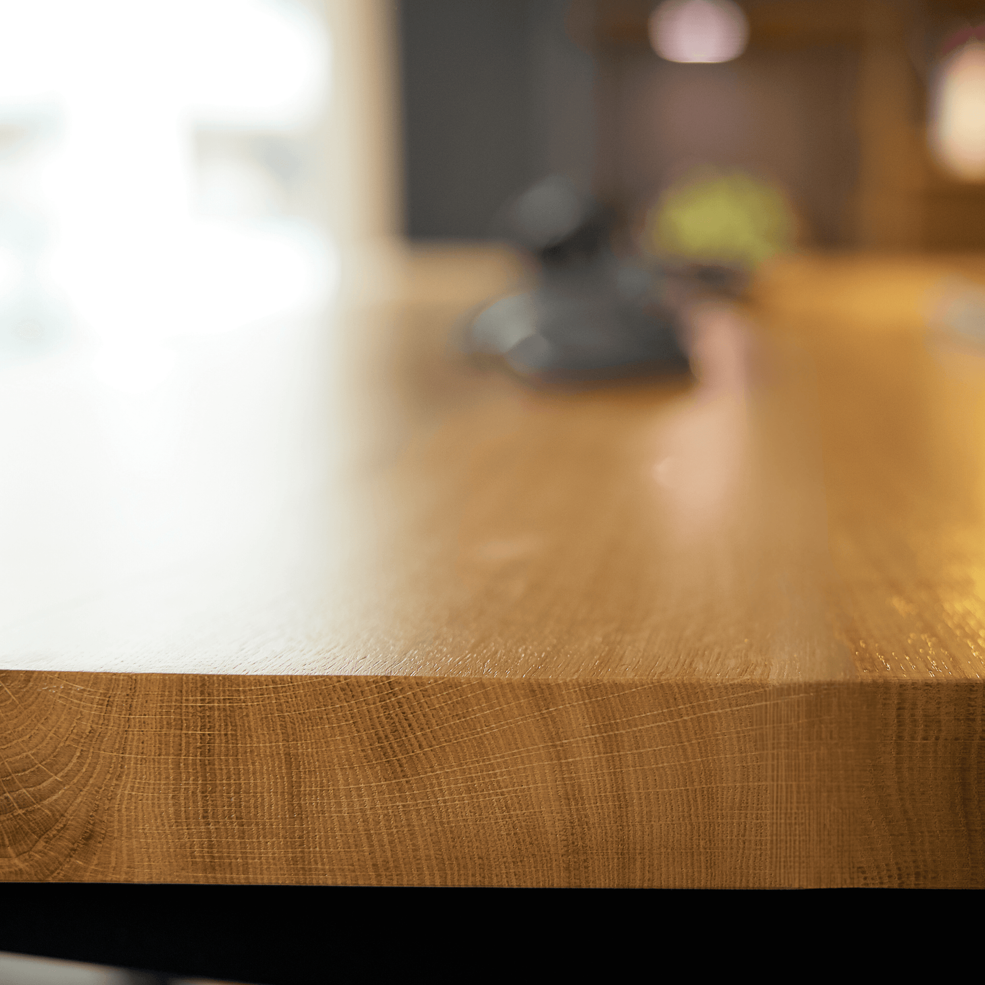 Detailed view of the Alive Oak desk's live edge finish and wood texture.